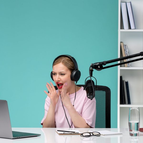 blogger-journalist-cute-young-blonde-girl-recording-video-computer-screaming