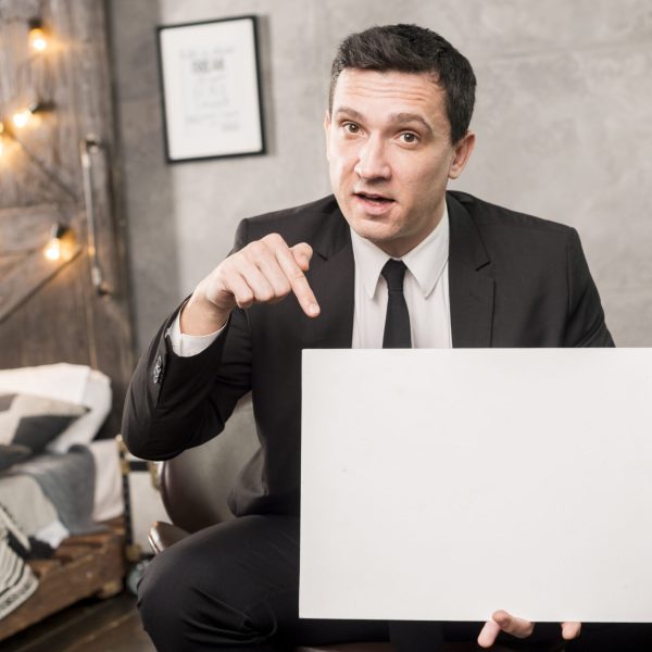 businessman-with-empty-paper-sitting-chair