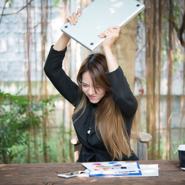 Business Woman getting crazy with of her laptop.