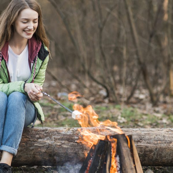 low-angle-girl-cooking-marshmallow